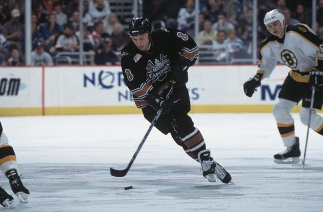Dmitri Khristich skates with the puck